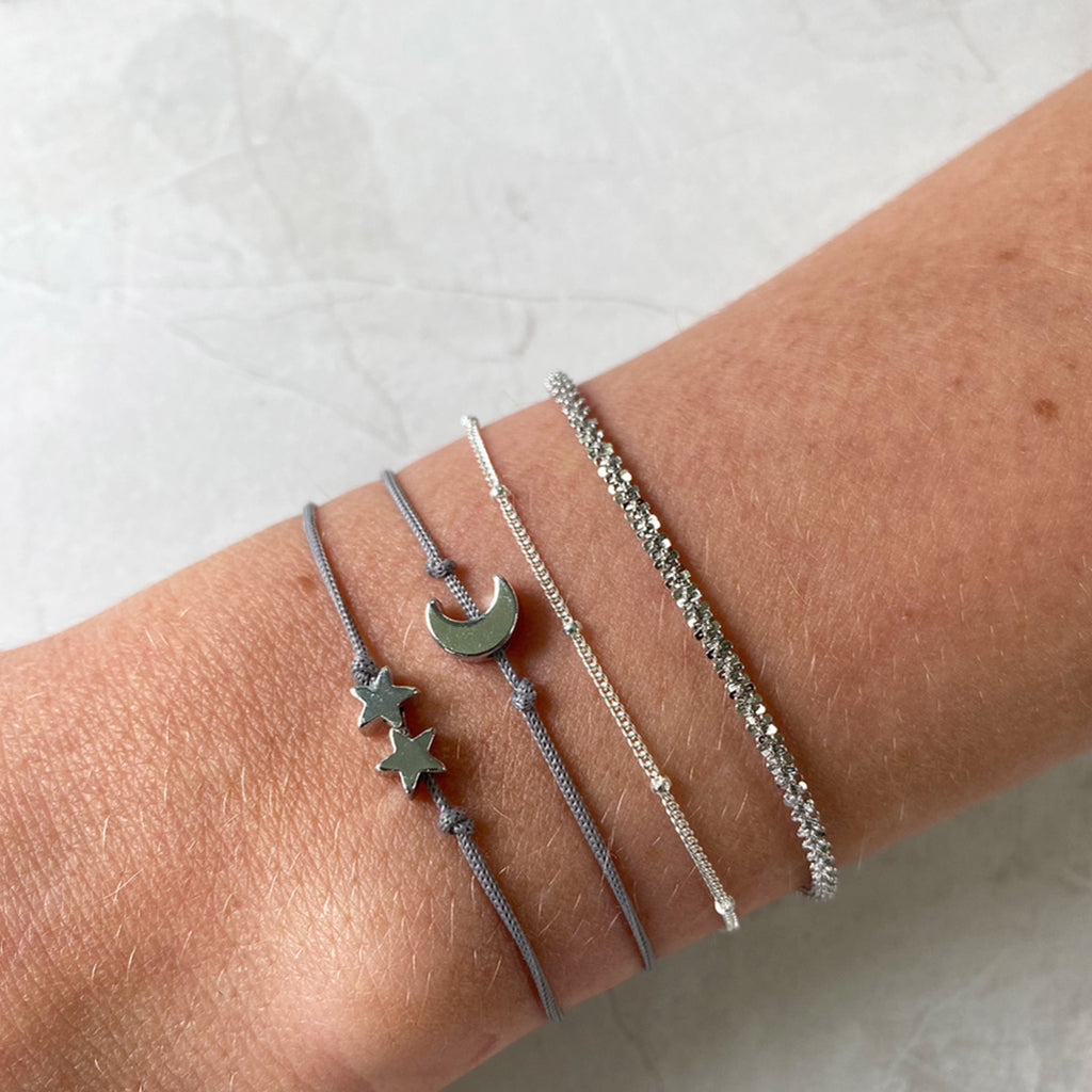 Silver charm threaded bracelet