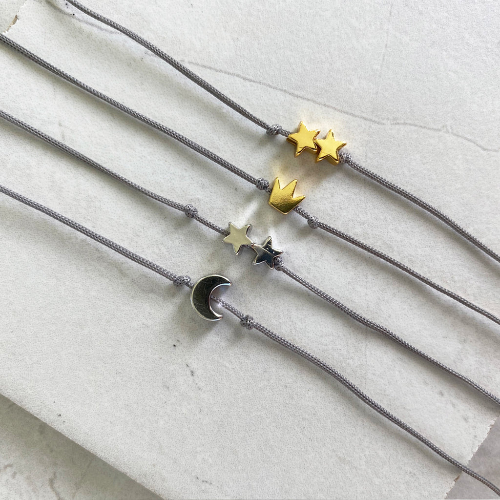 Gold charm threaded bracelet